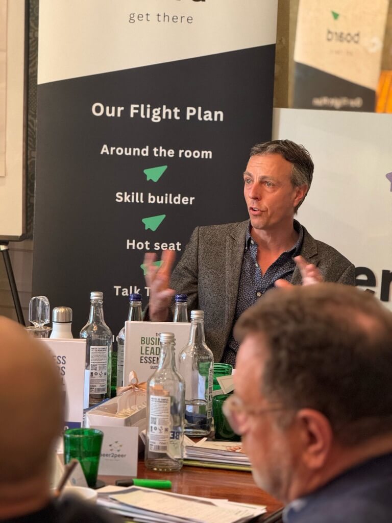 Justin Neale presenting to a group of business owners at Lime Wood Hotel in the New Forest